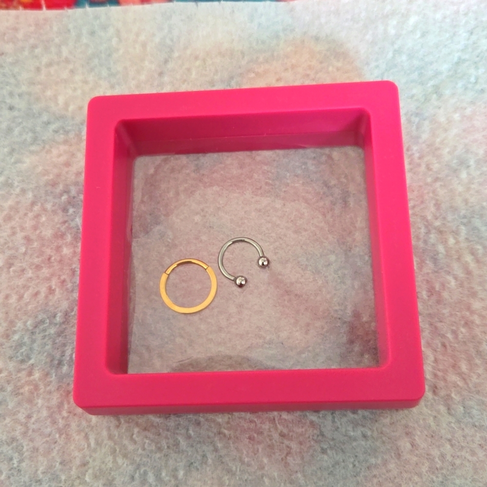 16 G Gold septum rings Unopened.  Unused